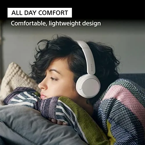 Headphones connected to a phone and a laptop showing multipoint pairing