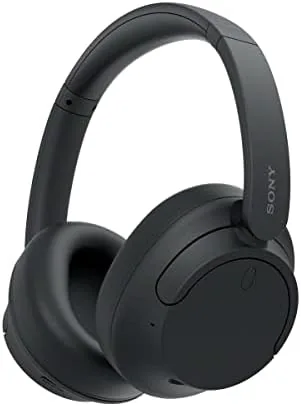Sony WH-CH720N headphones in black resting on a desk, showing the lightweight over ear design