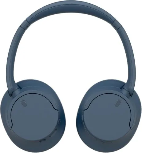 The blue WH-CH720N in a backpack with a charging cable, ready for travel