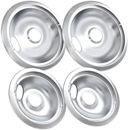 The set of four stove burner drip pans laid out on a countertop