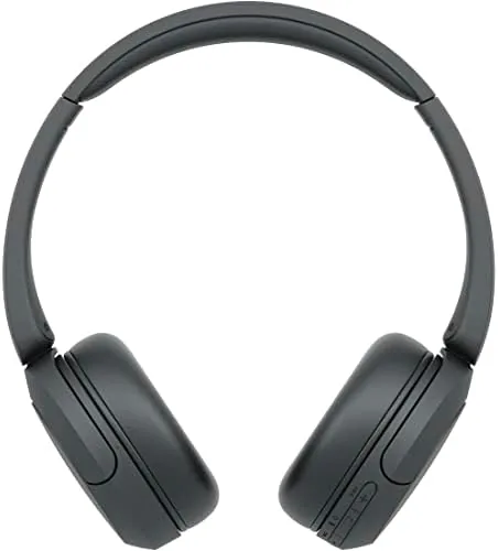 The black Sony WH-CH520 headphones resting on a desk