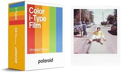 The Polaroid i-Type film triple pack boxes stacked with developed photos