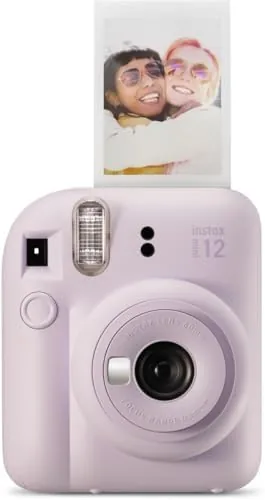 The lilac purple Fujifilm Instax Mini 12 sitting on a table with prints beside it