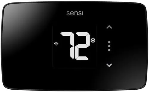 The Sensi Lite thermostat mounted on a hallway wall with its small display showing the <a href=
