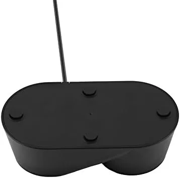 Bedroom desk setup with the PS4 VR dock keeping controllers charged and organized