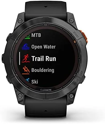 The watch flashlight illuminating a dark trail ahead during an evening run