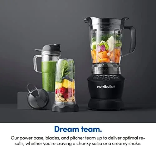 A counter scene with a completed smoothie and a bowl of soup made with the blender