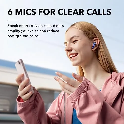 Liberty 4 NC earbuds resting on a desk with a phone