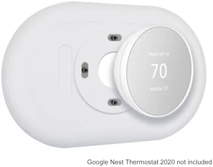 Nest thermostat with trim plate compared against a bare wall with old screw holes