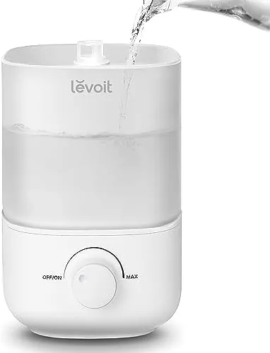 Levoit top fill humidifier on a bedroom nightstand with soft morning light