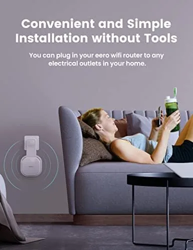 The wall mounted eero compared to a router sitting on a crowded shelf