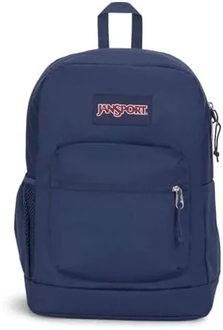JanSport Cross Town Plus backpack in Navy standing upright on a desk