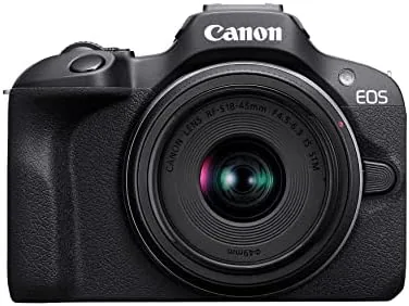The Canon EOS R100 with the RF-S18-45mm kit lens on a desk