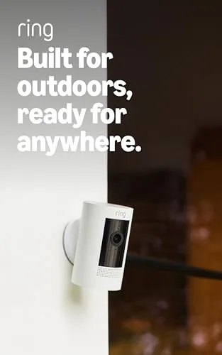 White Ring Outdoor Cam mounted under a porch eave overlooking a driveway