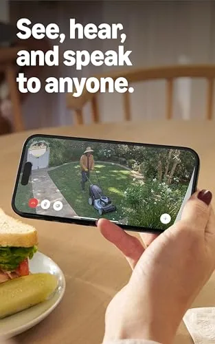 Outdoor Cam capturing a delivery person at the front door in daylight