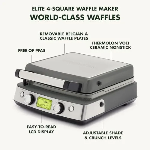 Four finished golden waffles lifted from the plates of the maker