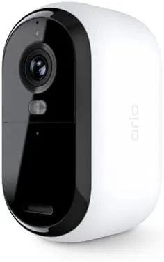White Arlo Essential 2K camera mounted on a porch wall pointing at the driveway