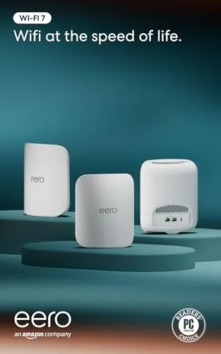 Three eero Pro 7 nodes sitting on a table ready for setup