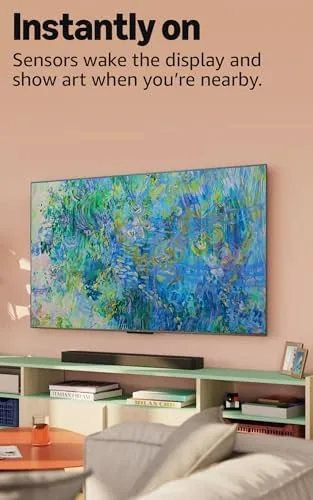 Ember 55 mounted on a wall in a dim media room showing its black levels