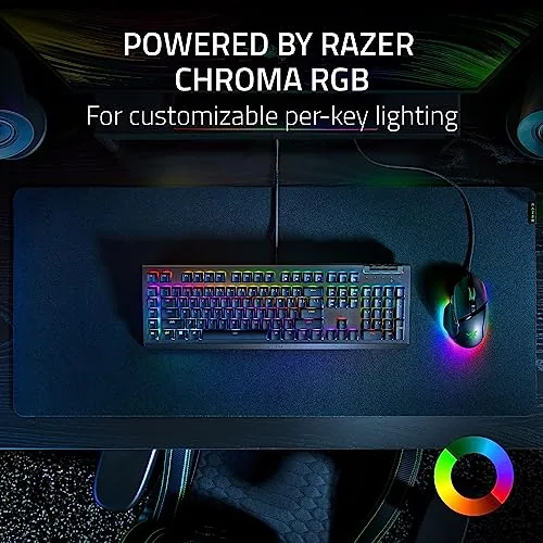 A gamer setting at a desk with the BlackWidow V4 X front and center and RGB on