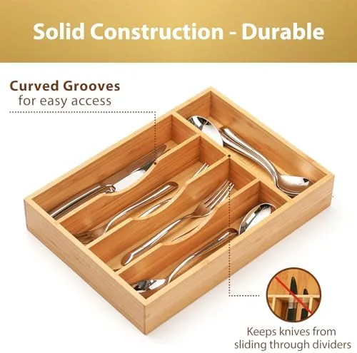 The organizer drawer fully stocked with cutlery and small kitchen tools in place