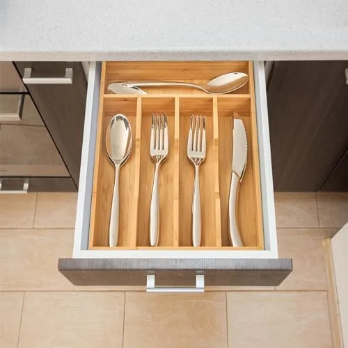 The bamboo organizer in a tidy kitchen drawer with matching cutlery in each slot