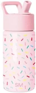 The Simple Modern kids bottle in the Confetti pattern standing on a kitchen counter