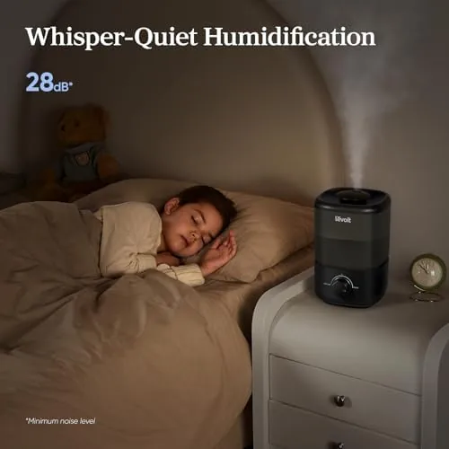 The humidifier positioned beside houseplants in a bright living room