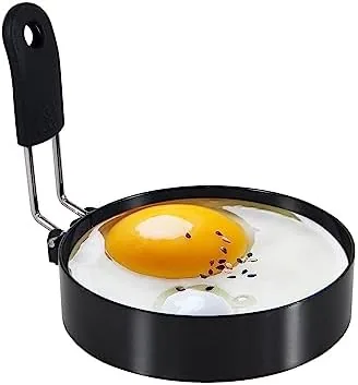 The set of 3.5 inch stainless steel egg rings with silicone handles on a counter