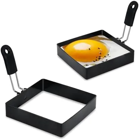 A plate of round pancakes and a fried egg made with the egg rings
