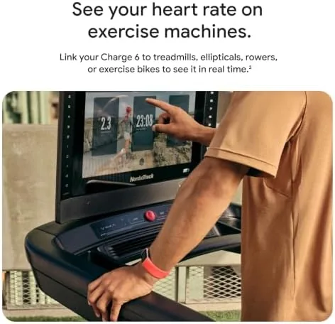 Fitbit Charge 6 on a wrist showing a workout with heart rate