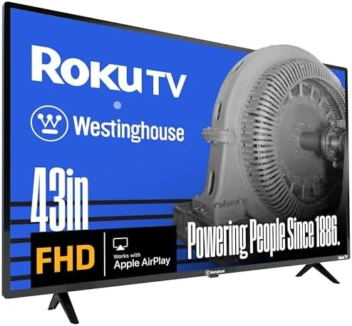 Westinghouse 43 inch Roku TV set up on a media stand with the home screen visible