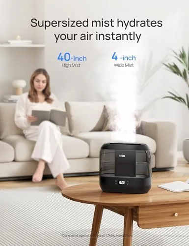 A hygrometer showing 50 percent humidity beside the running DREO humidifier