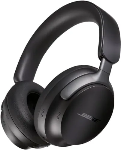 Bose QuietComfort Ultra headphones in black lying on a desk