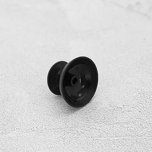 A thumbstick cap, a new controller, and an opened controller with a bare module