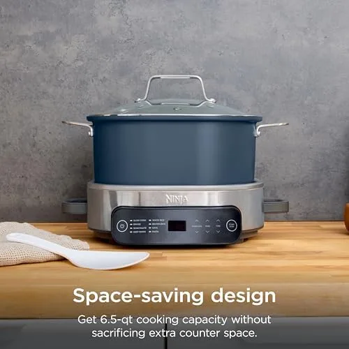 The removable ceramic coated pot sitting in a sink after cooking