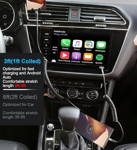 A phone on a dashboard mount with the coiled cable connected and running navigation