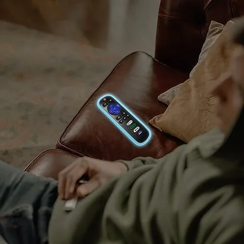 A hand holding a covered Roku remote during an evening of <a href=