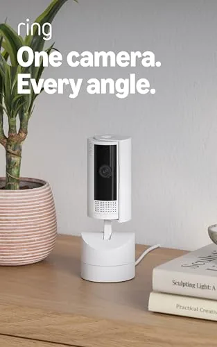 The Ring Pan-Tilt Indoor Cam mounted on a desk in a home office