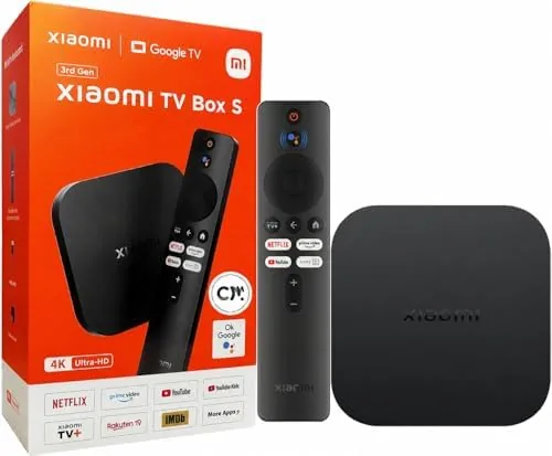 The Xiaomi TV Box S 3rd Gen sitting beside its remote in a living room