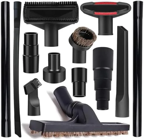 The 13 piece universal vacuum attachment kit spread out on a workshop bench