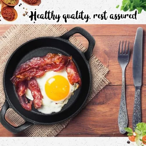The mini cast iron skillet set next to a ceramic ramekin and a nonstick pan