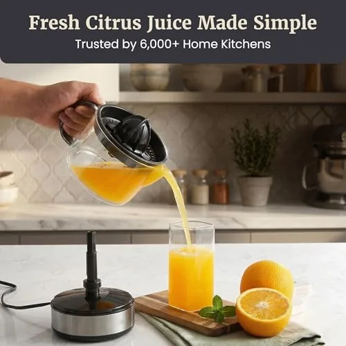 A breakfast table with glasses of fresh juice and the juicer nearby