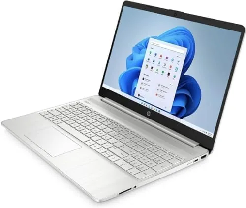 The HP 15 beside a Lenovo V15 on a desk