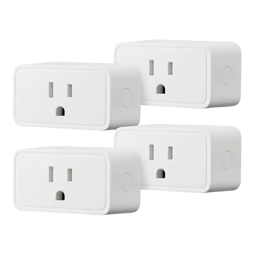 Four Amazon Basics smart plugs in a white box pack laid out on a table