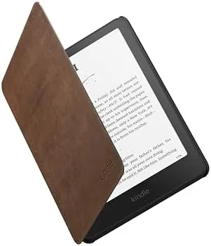 Kindle Paperwhite in the leather cover closed on a desk