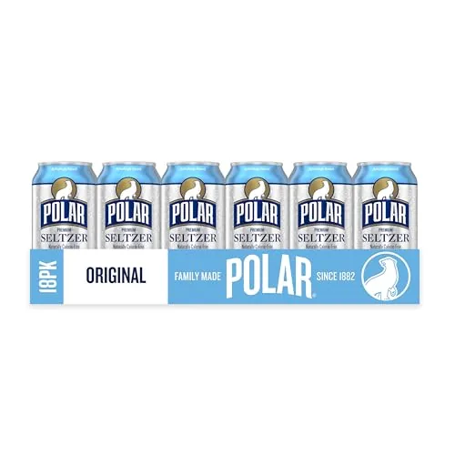 An ice filled glass of Polar seltzer being topped up from a can
