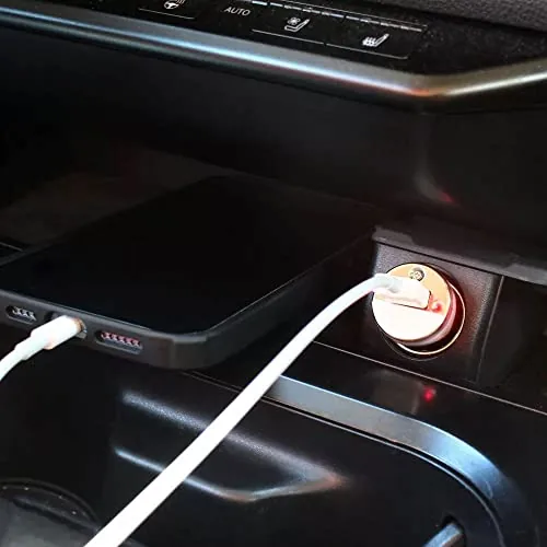The CarPlay cable next to a USB C to USB C cord and a wireless adapter