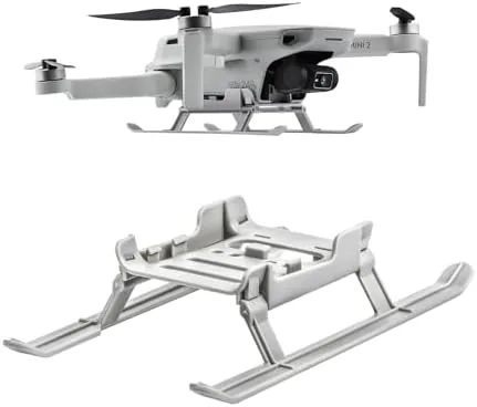 The foldable landing gear kit laid out beside a DJI Mini drone