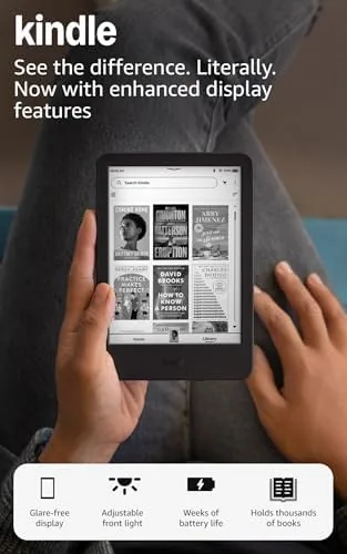 Black Kindle 16GB held in one hand showing its compact size